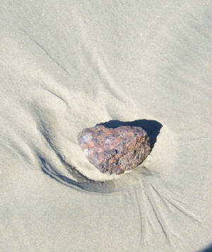 Rock in the sand